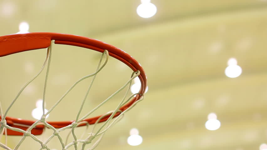 scoring basket in basketball court