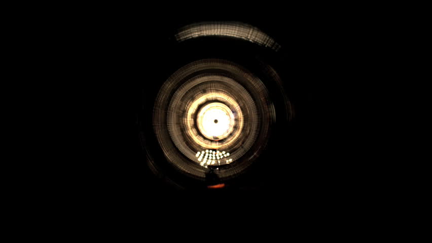 Camera plunges into a surreal luminescent tunnel and goes through light hoops resulting in a dizzying and spectacular vertigo effect.