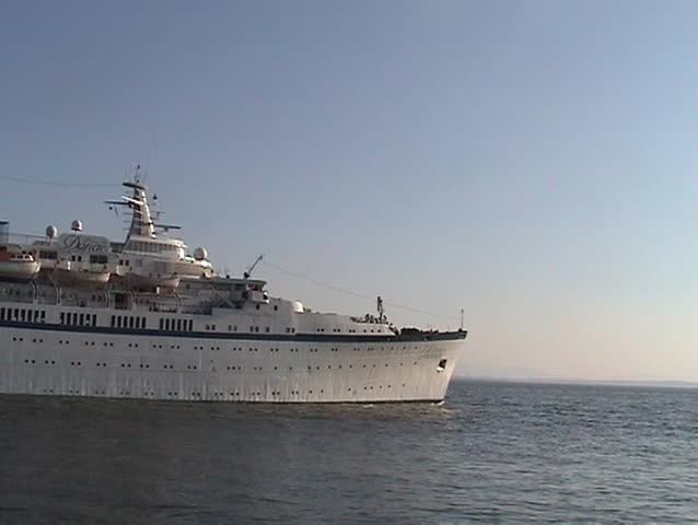Large cruise ship leaving  port