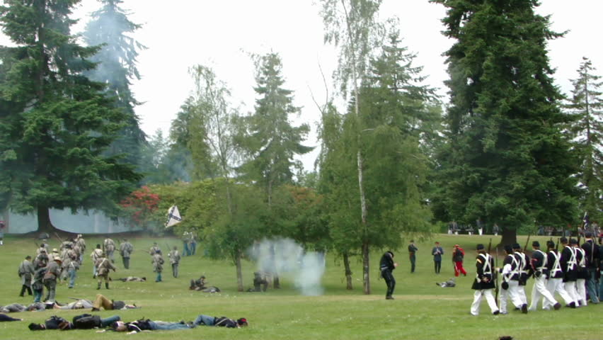 PORT GAMBLE, WA - JUN 20, 2009: 
Union line advances while Confederate infantry retreats.		in a mock battle at Port Gamble WA on Jun 20, 2009.
