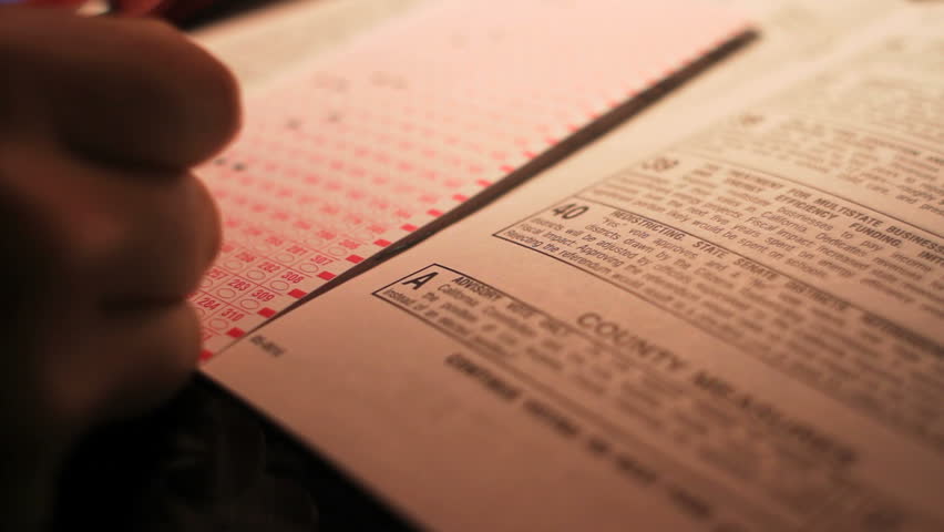 Voter Filling Out Election Ballot