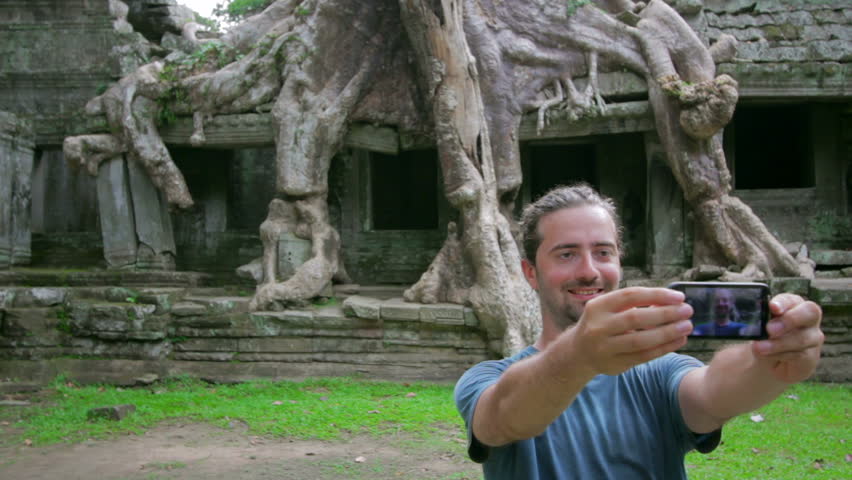 visitor taking picture, nature of preah khan temple, Angkor