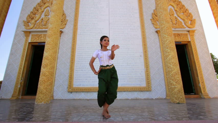 Beautiful Asian Girl performs Cambodian folk dance in temple
