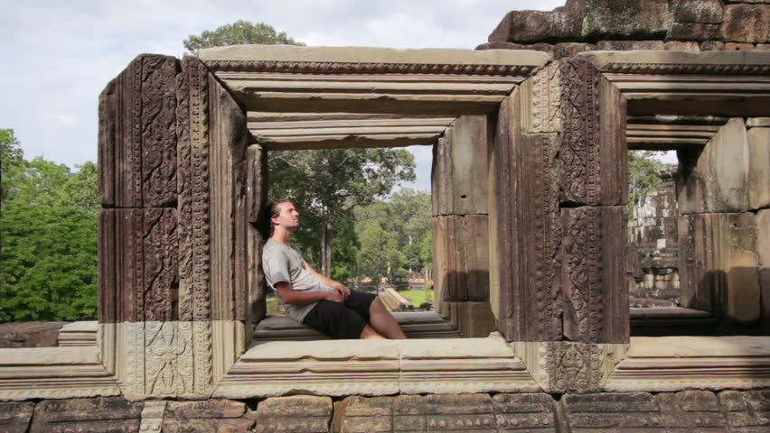 Caucasian tourist travel in baphuon temple, Angkor, Cambodia
