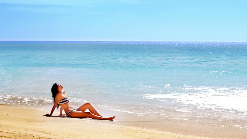 Sexy Asian Girl at Exotic Beach Sunbathing in the sun