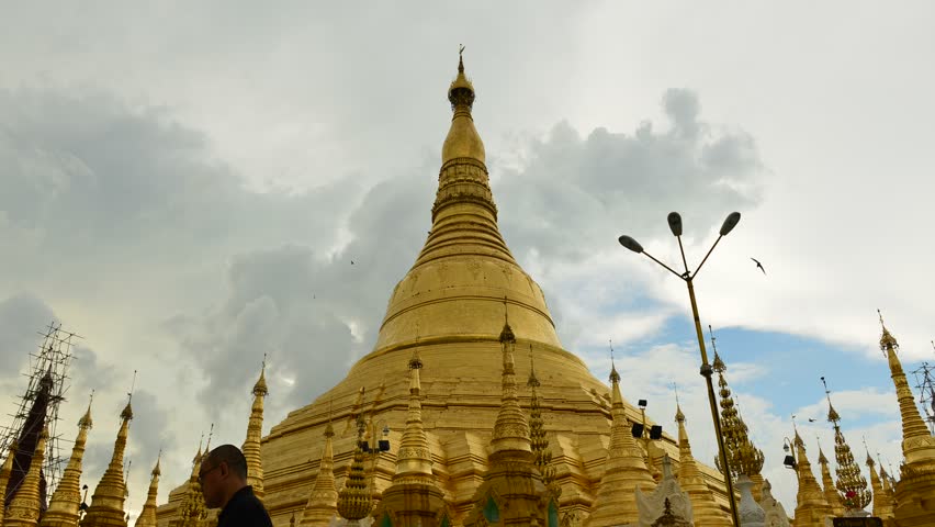 YANGON, MYANMAR - OCTOBER 24: Time lapse of tourists walking around the Shwedagon Pagoda Yangon on October 24, 2012 in Yangon, Myanmar