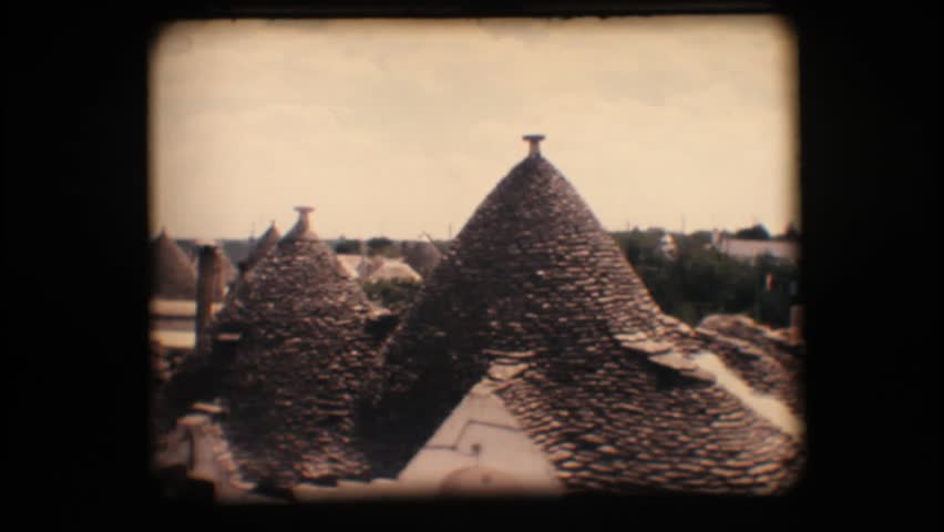 Vintage 8mm. View of Alberobello and its typical cone shaped houses (trullo)

