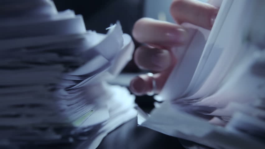 Working in office with documents and computer