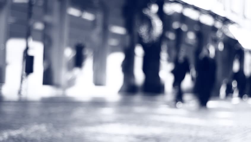 People on the street on a sunny day.