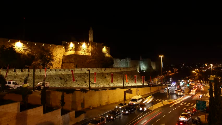 JERUSALEM, ISRAEL - NOVEMBER 01: Drivers, commuters and tourists hurry to their destinations during rush hour near the wall of Jerusalem, time lapse view, Israel, 01 November 2012