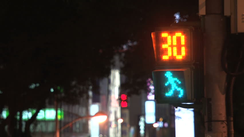 TAIPEI, TAIWAN - CIRCA 2012: Taipei traffic light counting down in seconds with walking green figure