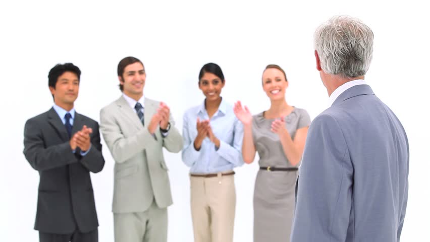 Boss being congratulated by co-workers against a white background