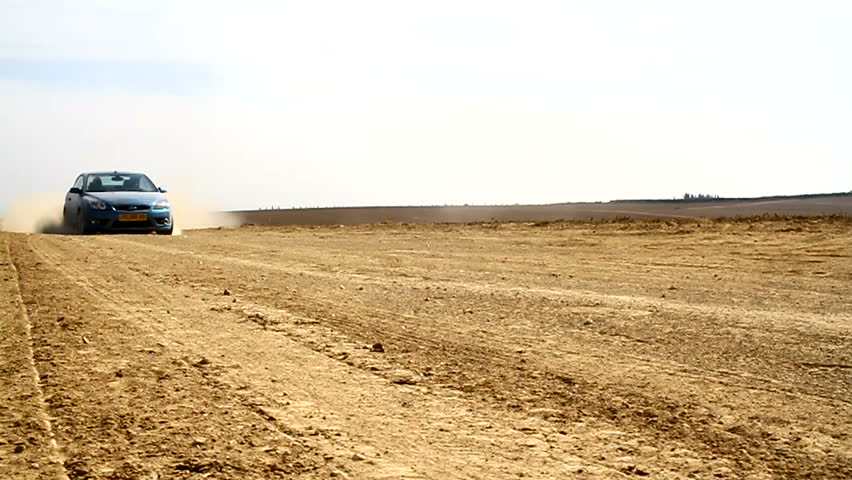 Car Drift's. Dolly Shot.

Car drifting on the high speed and makes a sand cloud.
