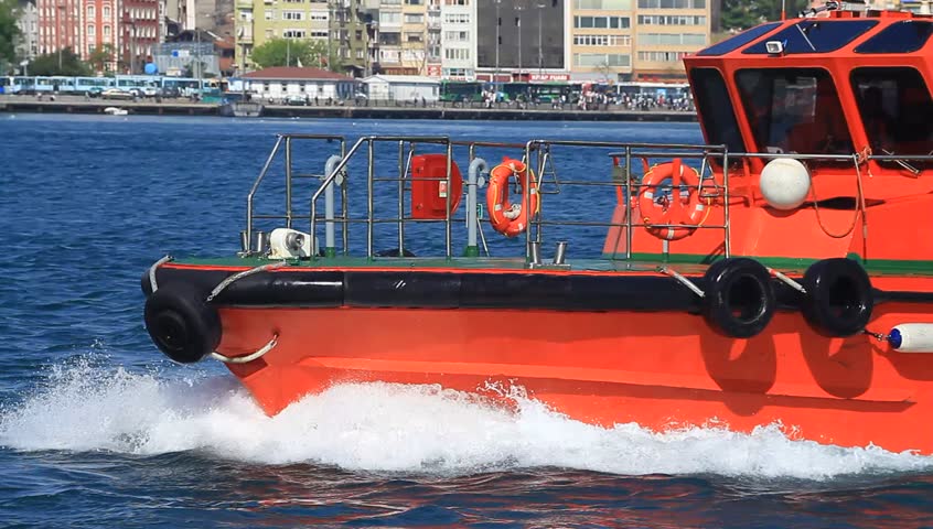 ISTANBUL - APRIL 28: Escort and ship handling tug boat KILAVUZ 1 sails into Bosporus Sea on April 28, 2012 in Istanbul. An escort tug boat is compulsory in straits for all tankers over 249,99 meters.
