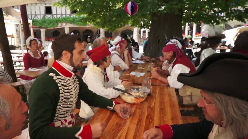 PEROUGES, FRANCE - JULY 14: People commemorate the French Revolution on July 14, 2012 in Perouges, France in an annual celebration by wearing historical costume and singing the popular songs of their ancestors.