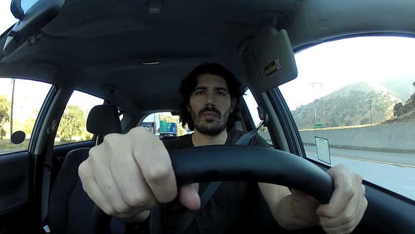 Young man driving angry