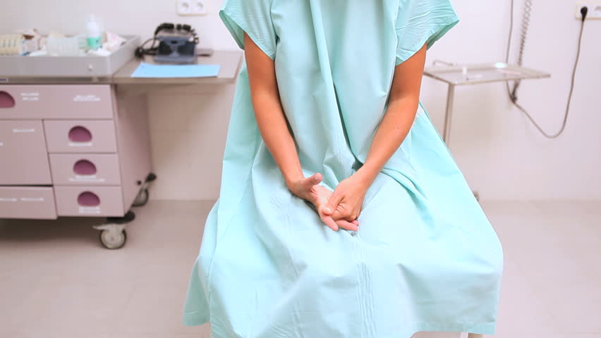 Video of an anxious patient sitting while waiting a doctor in examination room