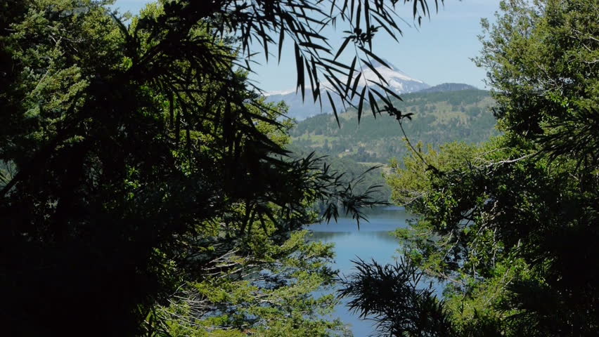 slider shot of volcano and lake