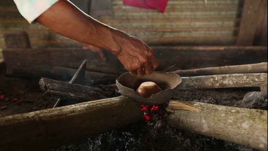 temperature is gently controlled by hand in order to prevent cracking