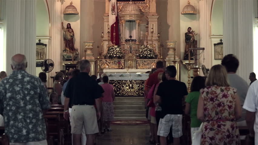 PUERTO VALLARTA, MEXICO - CIRCA NOV 2012: People attend mass at Our Lady of Guadalupe church circa November 2012 in Puerto Vallarta, Mexico.