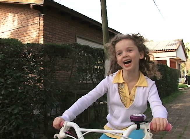 Girl riding a bicycle. Slow Motion