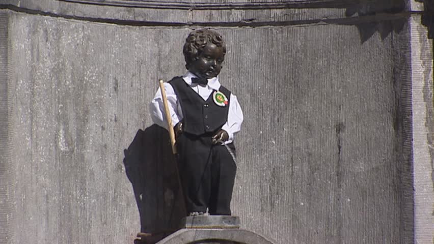 GRAND PLACE BRUSSELS, BELGIUM - 2005: Manneken pis ( Little Man Pee or le Petit Julien) is an iconic symbol of the Brussels spirit.  His wardrobe consists of more than 600 costumes.