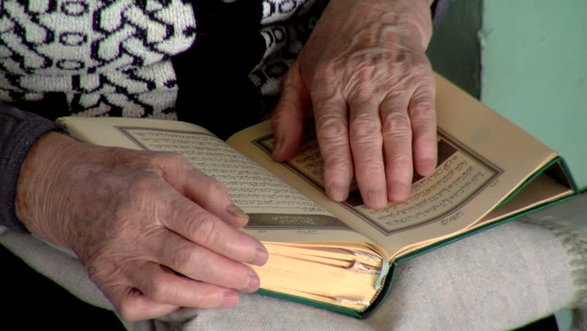 Muslim woman who reads the Kouran...