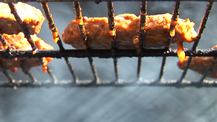 Beef stake barbecue cooked outdoors, close-up, smoke and nature
