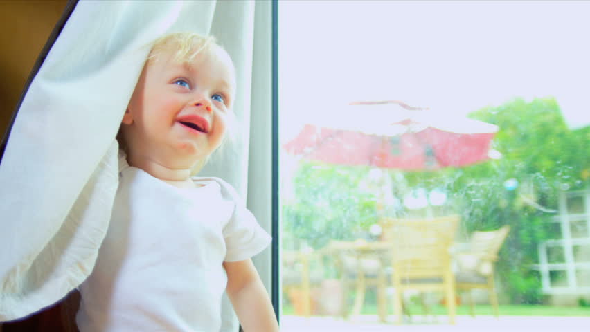 Baby Hide Seek Behind Curtains
