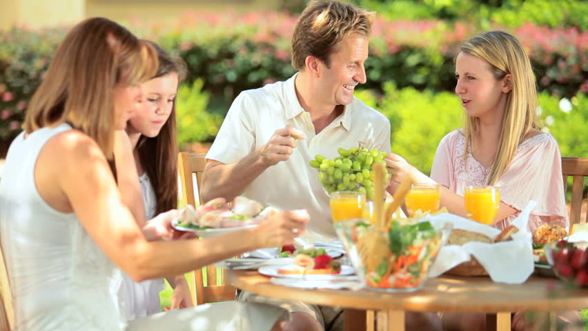 Caucasian family enjoying low calories lunch