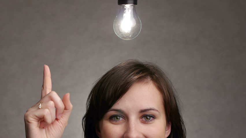 bulb lights up over a woman head when she gets an idea