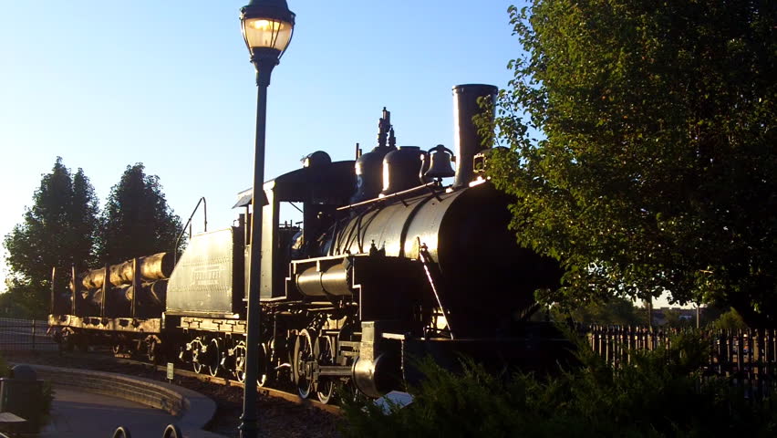 An historic old west locomotive train on display near Downtown Flagstaff, Arizona celebrates the town's involvement with lumber and the railroad.