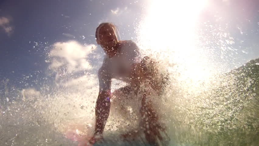 The Man Falls on His Surfing Board Upon Striking of the Waves