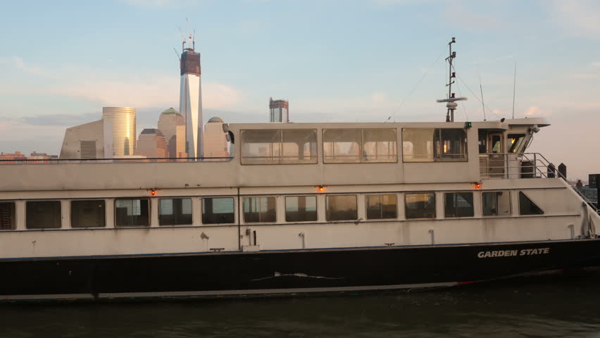 JERSEY CITY - DECEMBER 4: (Time-lapse) Ferry traffic operates at the Paulus Hook Ferry Terminal on the Hudson River across from the New York lower Manhattan skyline on December 4, 2012 in Jersey City.