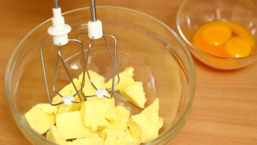 Making Chocolate Sponge Cake. Series. Beating butter with a whisk.
