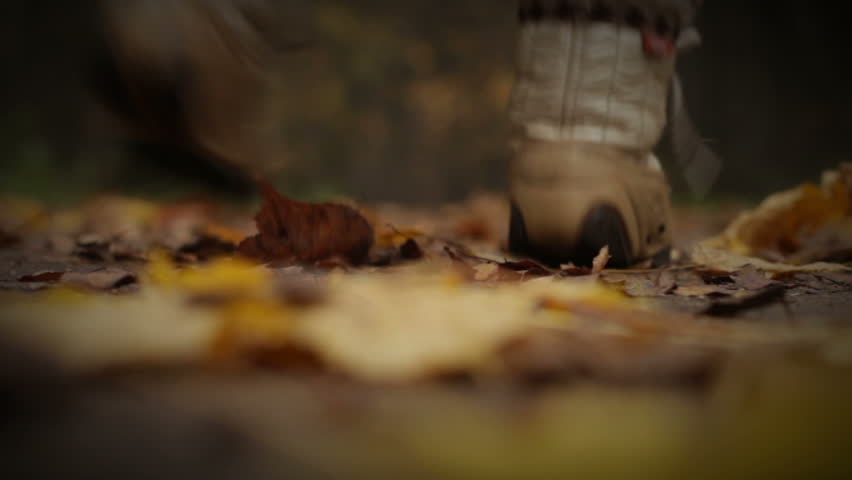 Autumn games abstract, 720HD, closeup, unrecognizable persons jumping on leaves.