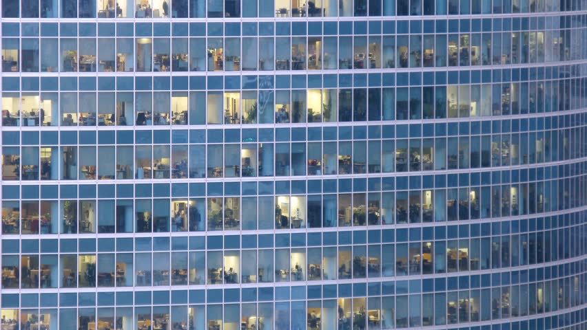 Office building viewed in the evening. Time lapse