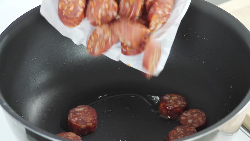 Sliced paprika being fried in a pan