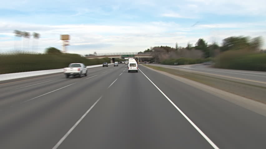 SACRAMENTO, CA - CIRCA 2012: Time lapse POV shot from the middle lane heading toward Sacramento, California on Interstate 80, various lane changes and passing vehicles to enjoy.