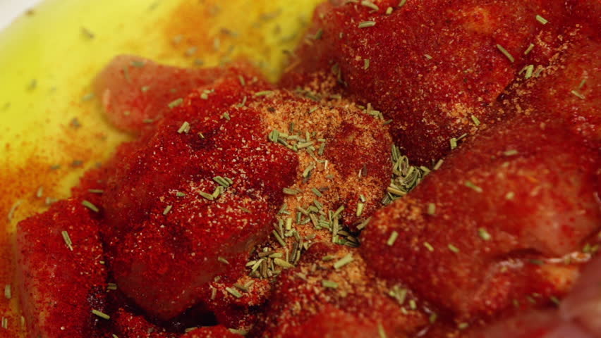 Seasoning chicken meat with spices