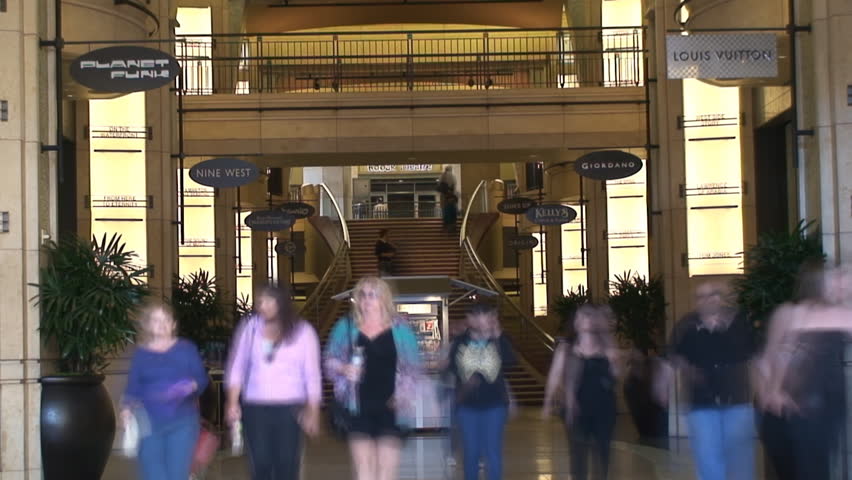 HOLLYWOOD BOULEVARD, LOS ANGELES - CIRCA 2009:  People entering and exiting a shopping Mall on Hollywood Blvd, Los Angeles