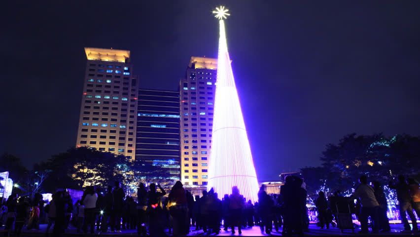 NEW TAIPEI CITY, TAIWAN - CIRCA DECEMBER 17,2012: (Time lapse) People gathering together at The Civic Plaza of New Taipei City and enjoy the Christmas tree light show held before the Christmas.  