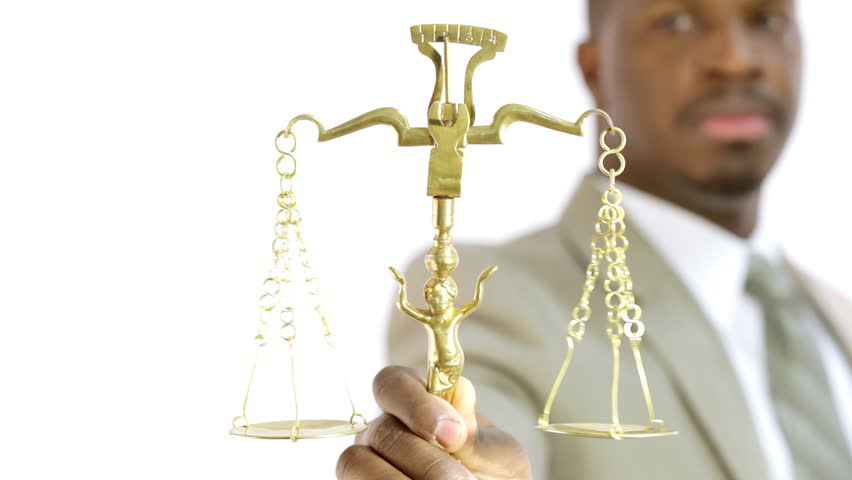 Lawyer holding up scales of justice