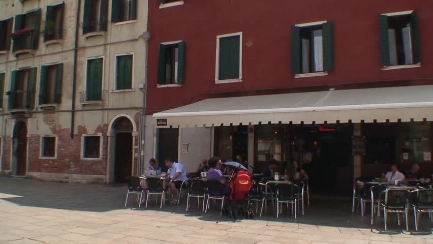 VENICE, ITALY - CIRCA 2011: Nun walking and life in a busy square in Venice.