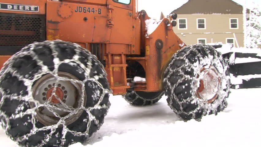 GOVERNMENT CAMP, OREGON - CIRCA 2012: Large tractor snow plowing roads after blizzard snow storm in Oregon, USA circa 2012.