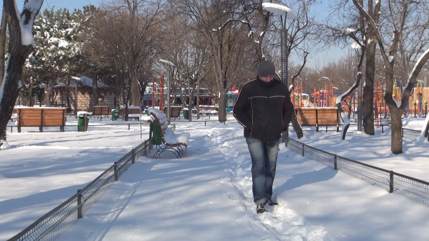 Sad, Depressed Man Walking Alone in Snow in an Empty Park, Sad Man In Winter