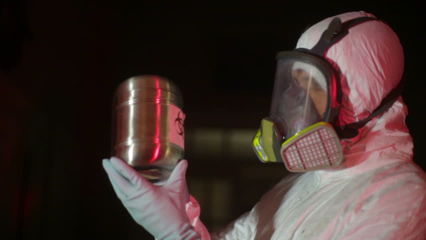 hazmat looking at a bio-hazard suit