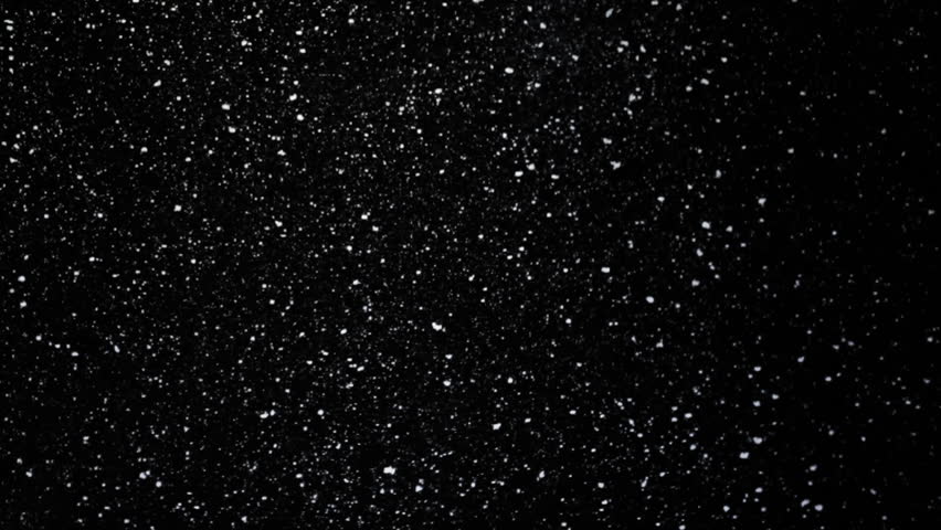 Artificial theatre snow on black background. Real shot, not cg. Use it with your footage with screen mode.