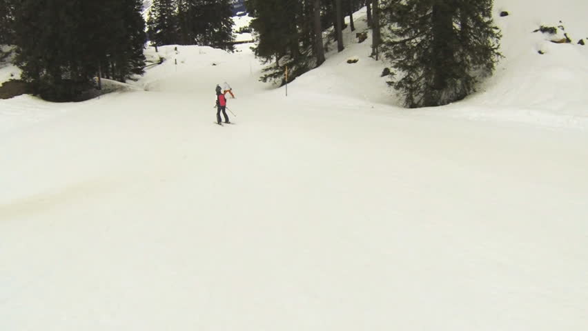 Slowmotion action cam shot of a ski track. Snowboard POV