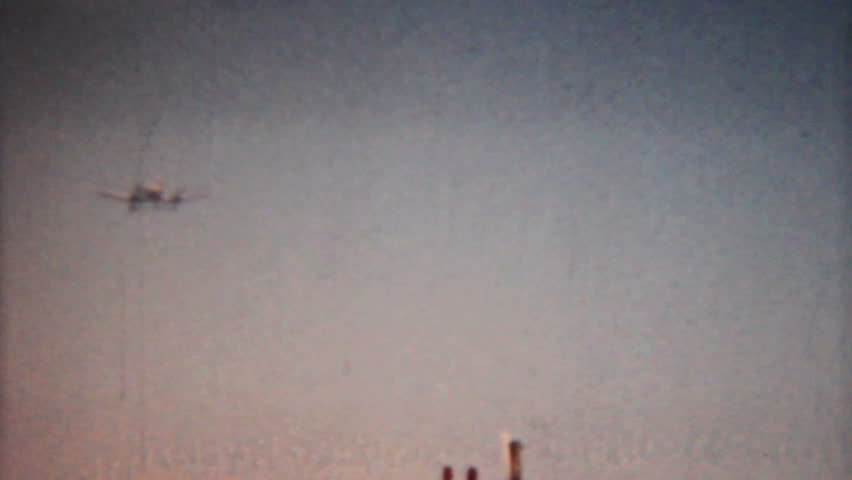 A small airplane comes in for a landing at the local airport in Moosic, Pennsylvania - 1958 Vintage 8mm film.